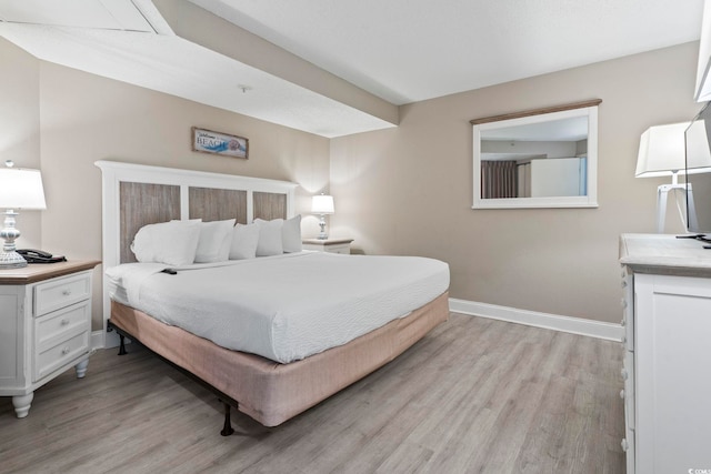 bedroom with light wood-type flooring