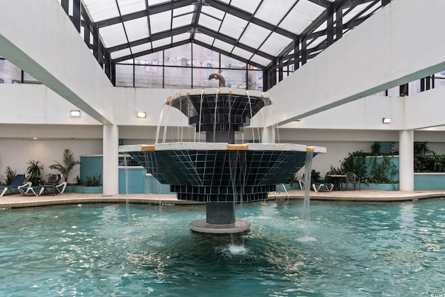 view of pool with pool water feature