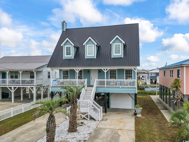 view of front facade with a garage and covered porch