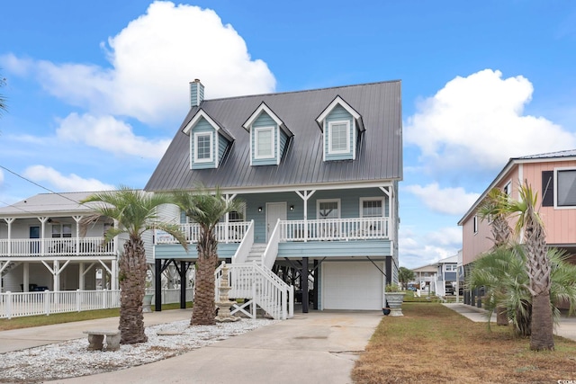 view of front facade with a garage and a porch