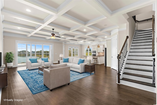 living room with coffered ceiling, crown molding, ceiling fan, dark hardwood / wood-style flooring, and beam ceiling