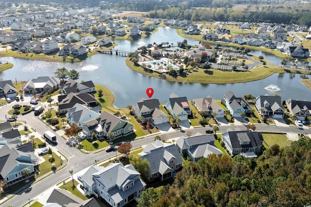 birds eye view of property featuring a water view