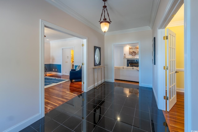 hallway featuring crown molding and dark hardwood / wood-style floors