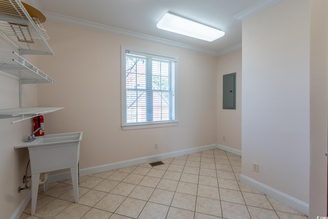 tiled spare room with electric panel and crown molding