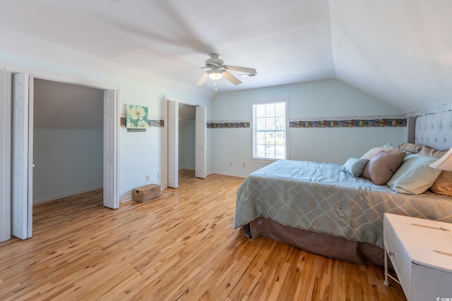 bedroom featuring vaulted ceiling, light wood-type flooring, and ceiling fan