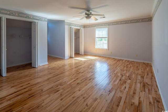 unfurnished bedroom with ornamental molding, light hardwood / wood-style floors, and ceiling fan