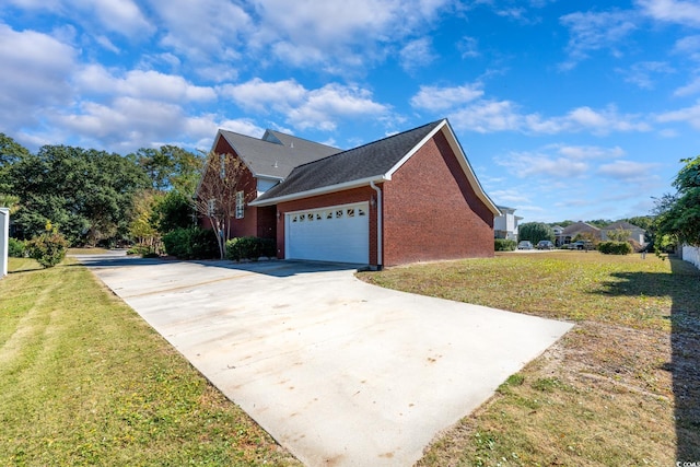 view of property exterior with a yard and a garage