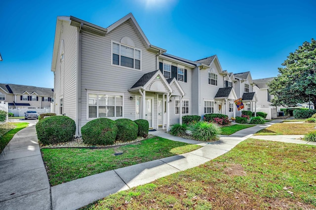 view of property with a front lawn