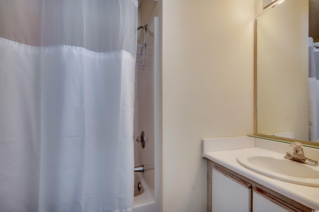 bathroom with vanity and shower / tub combo