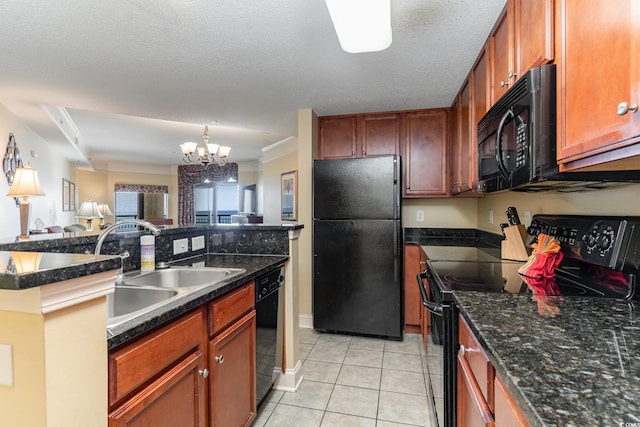 kitchen with black appliances, light tile patterned flooring, a textured ceiling, and a chandelier