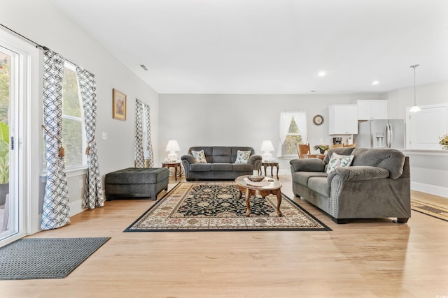 living room with light hardwood / wood-style flooring