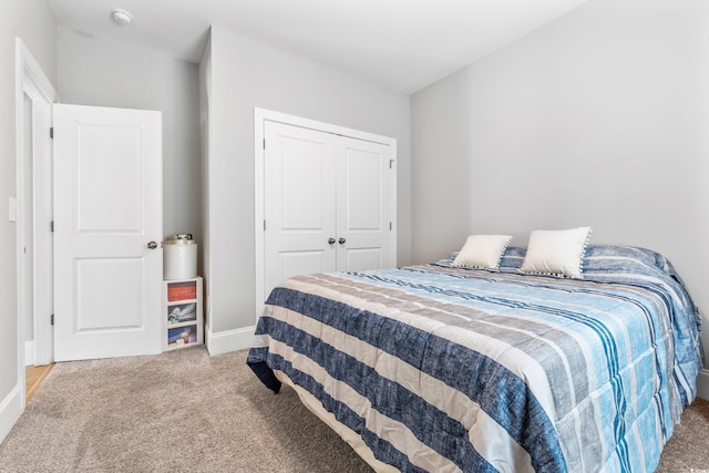 bedroom with carpet floors and a closet