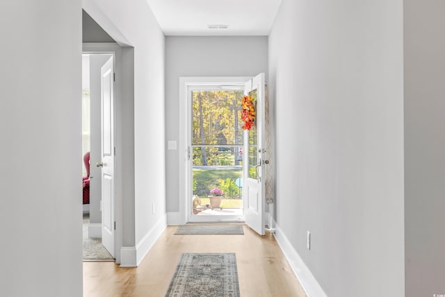 doorway with light hardwood / wood-style floors