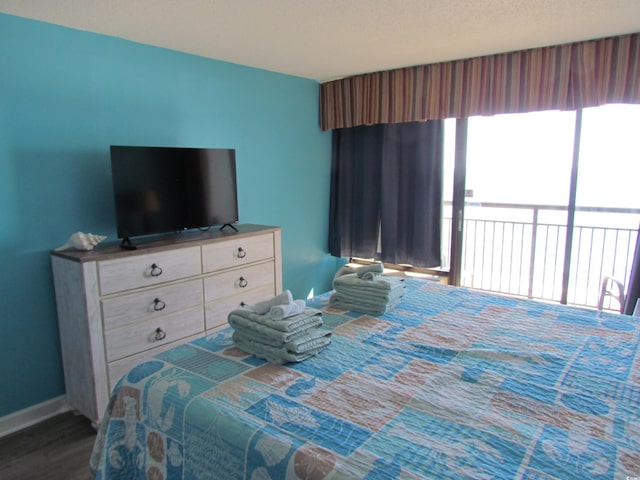 bedroom with dark wood-type flooring