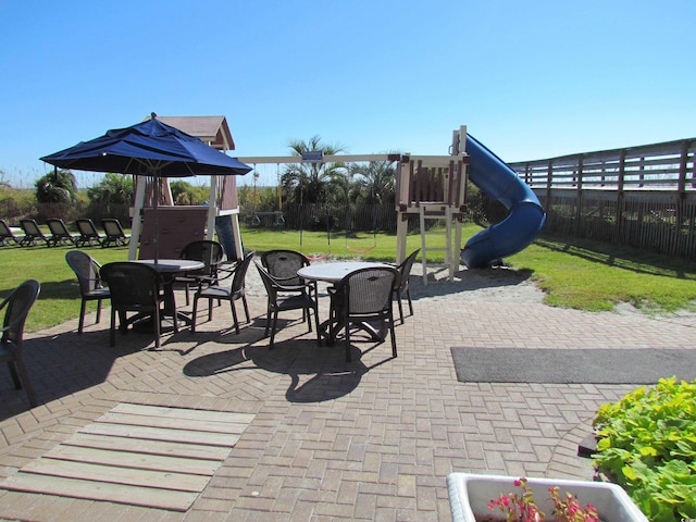 view of patio featuring a playground