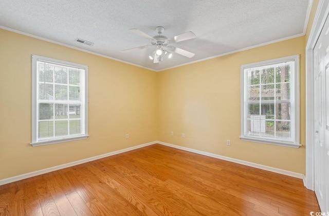 244 George Washington Trl, Georgetown, SC 29440 - unfurnished room featuring light wood finished floors, a textured ceiling, baseboards, ceiling fan, and ornamental molding