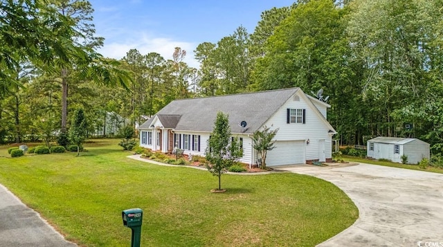 244 George Washington Trl, Georgetown, SC 29440 - view of front of house featuring driveway, a front yard, view of wooded area, and an attached garage