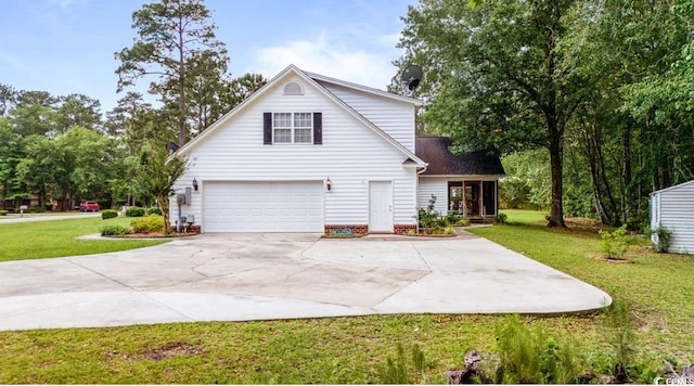 244 George Washington Trl, Georgetown, SC 29440 - traditional home featuring a garage, driveway, and a front yard