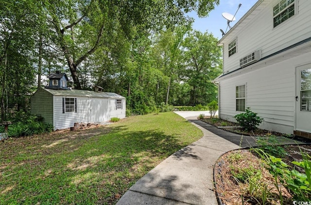 244 George Washington Trl, Georgetown, SC 29440 - view of grassy yard featuring an outdoor structure and a storage unit