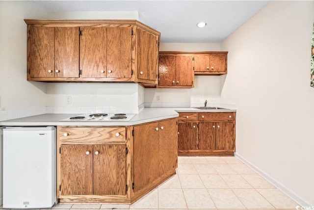 244 George Washington Trl, Georgetown, SC 29440 - kitchen with white electric cooktop, light countertops, and brown cabinets