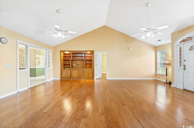 244 George Washington Trl, Georgetown, SC 29440 - unfurnished living room with ceiling fan, light wood finished floors, high vaulted ceiling, baseboards, and built in features