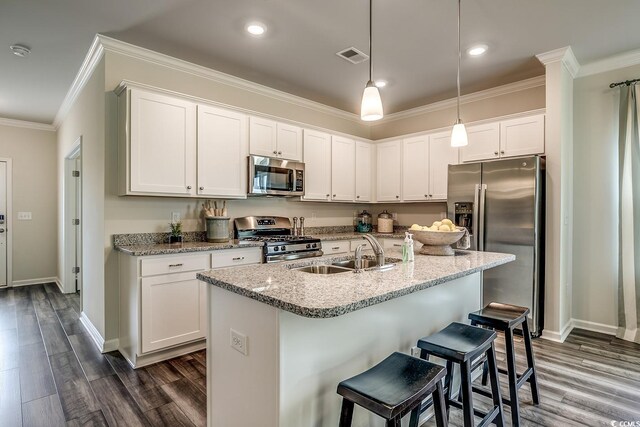 dining area featuring ornamental molding and dark hardwood / wood-style flooring