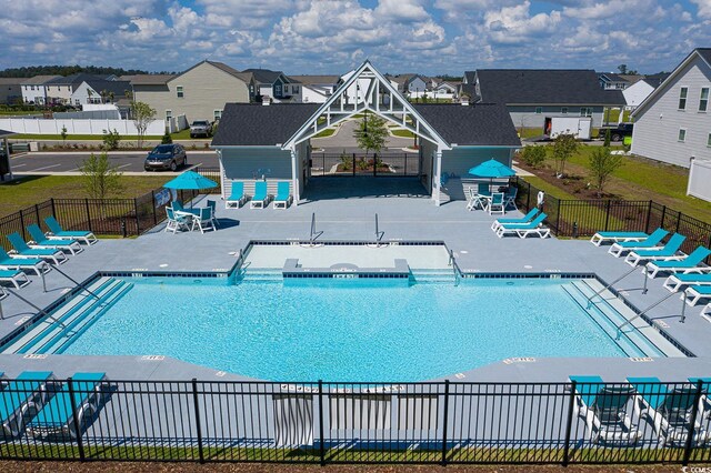 view of pool with a yard and a patio area