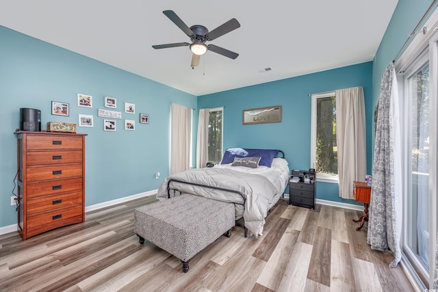 bedroom with light wood-type flooring and ceiling fan