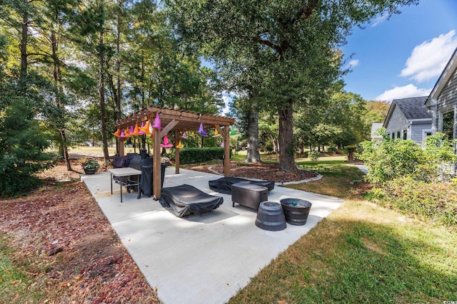 view of patio with a pergola and a fire pit