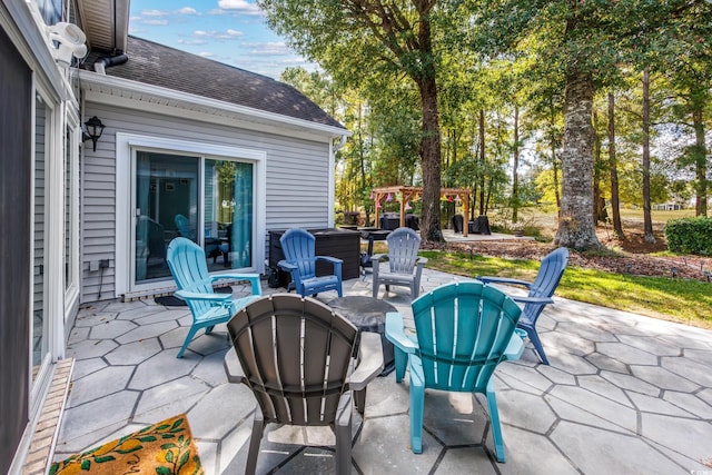 view of patio / terrace featuring a pergola and an outdoor fire pit