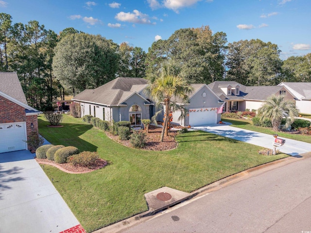 view of front of property featuring a front lawn and a garage