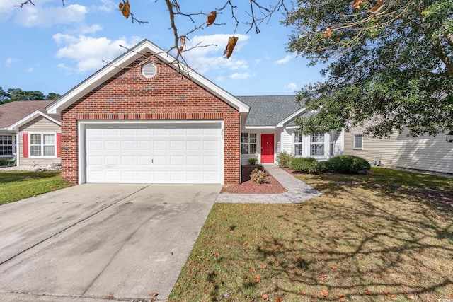 view of front of house with a garage and a front lawn