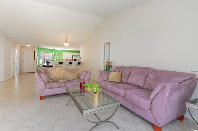 living room featuring light tile patterned floors and vaulted ceiling