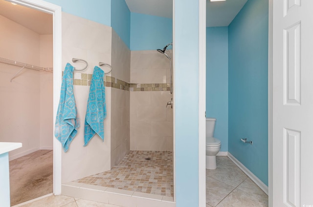 419 Mckendree Ln, Myrtle Beach, SC 29579 - bathroom featuring a tile shower, tile patterned floors, and a walk in closet
