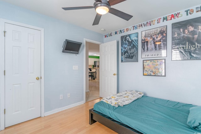 bedroom featuring wood-type flooring and ceiling fan