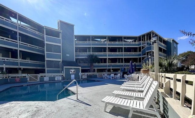 community pool featuring a patio area