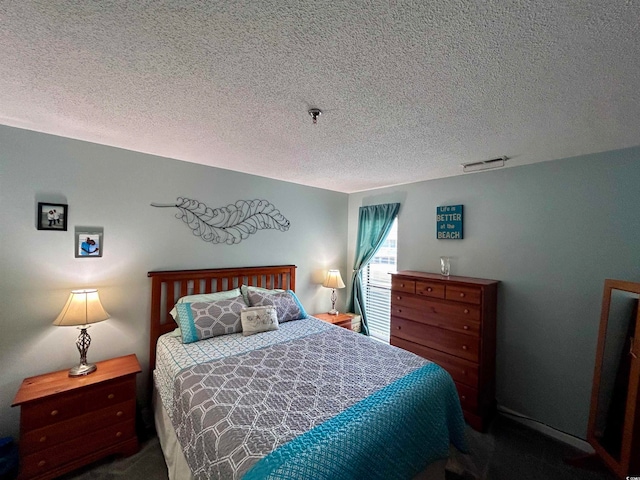 bedroom featuring a textured ceiling