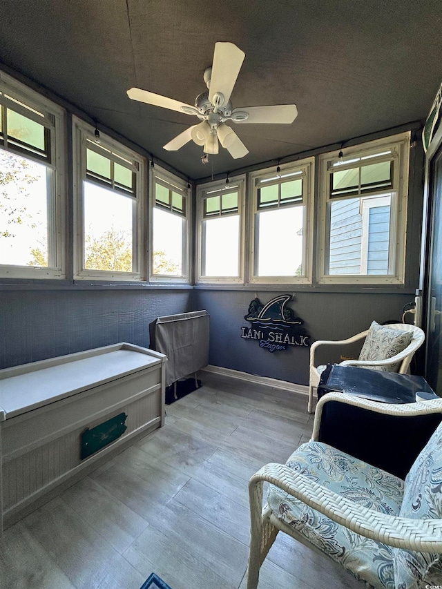 sunroom / solarium with ceiling fan