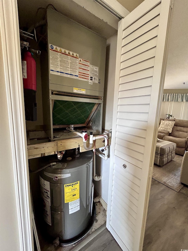 utility room with electric water heater