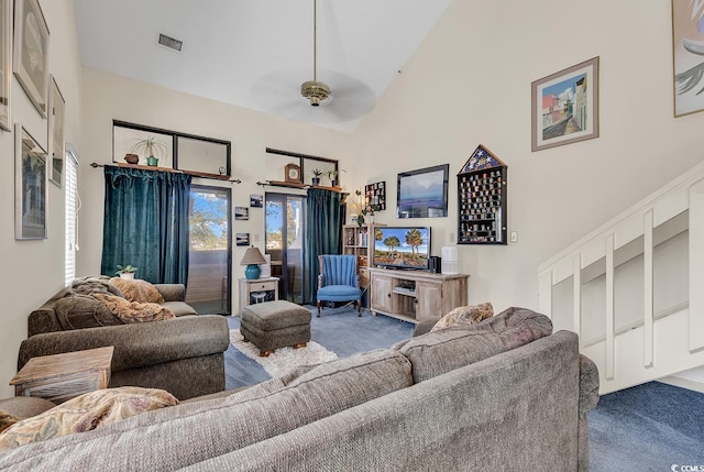 living room featuring ceiling fan, high vaulted ceiling, and carpet flooring