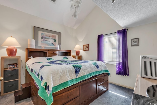 bedroom with lofted ceiling, carpet floors, and a textured ceiling