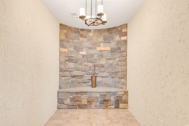 details with a notable chandelier and tile patterned flooring