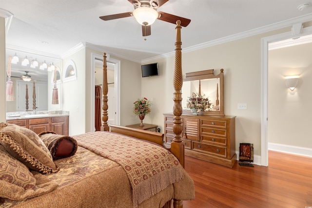 bedroom featuring ensuite bathroom, hardwood / wood-style flooring, crown molding, and ceiling fan