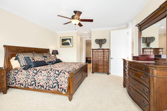 carpeted bedroom with crown molding and ceiling fan