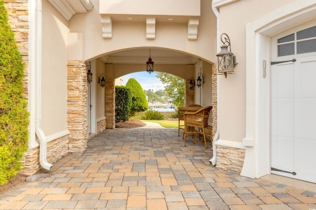 doorway to property with a patio