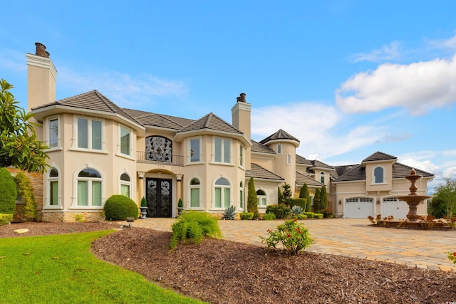 view of front of house with a garage and a balcony