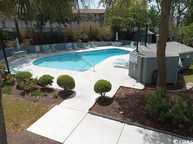 311 69th Ave N Unit 104, Myrtle Beach, SC 29572 - community pool with a patio and fence