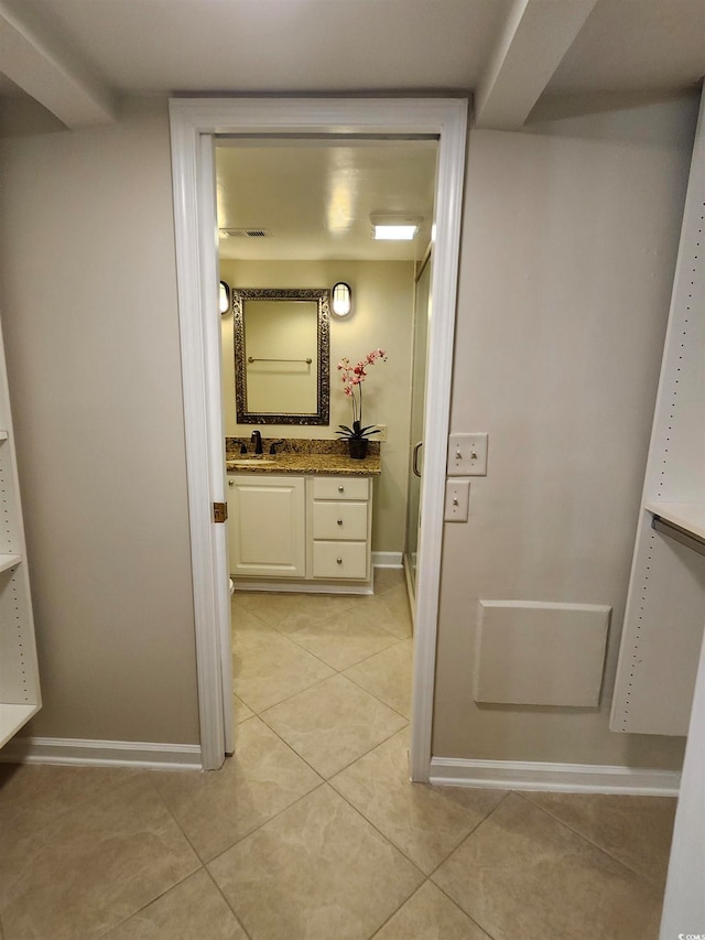 bathroom with vanity and tile patterned flooring