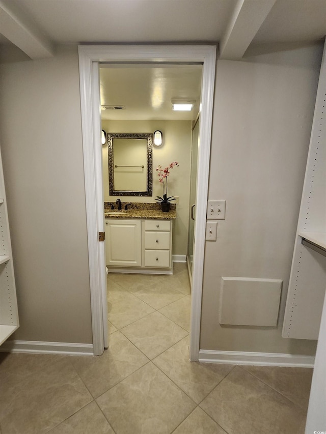 311 69th Ave N Unit 104, Myrtle Beach, SC 29572 - bathroom with vanity, baseboards, visible vents, and tile patterned floors