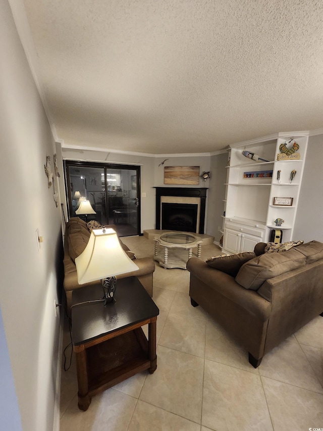 311 69th Ave N Unit 104, Myrtle Beach, SC 29572 - living area with crown molding, a textured ceiling, a fireplace with raised hearth, and light tile patterned floors
